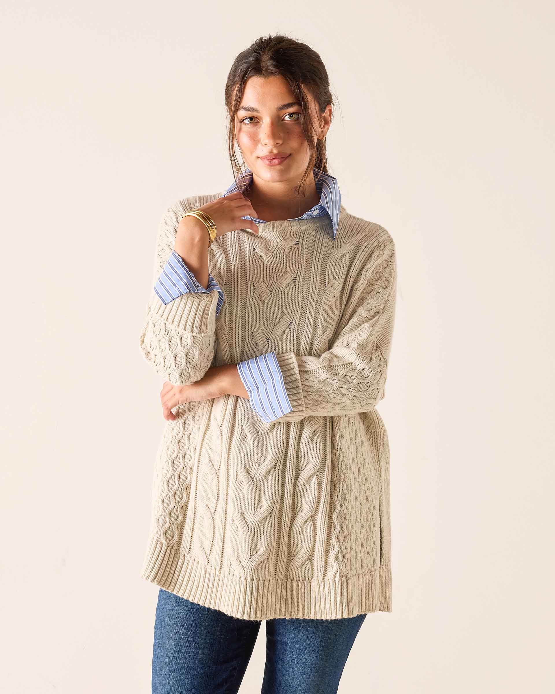 Ladies' travel-ready sea salt oversized cable knit sweater with layered collar and cuffs.