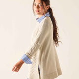 Sea Salt cream knit chunky-stitch oversized cardigan featuring a cable stitch pattern and ribbed hem.