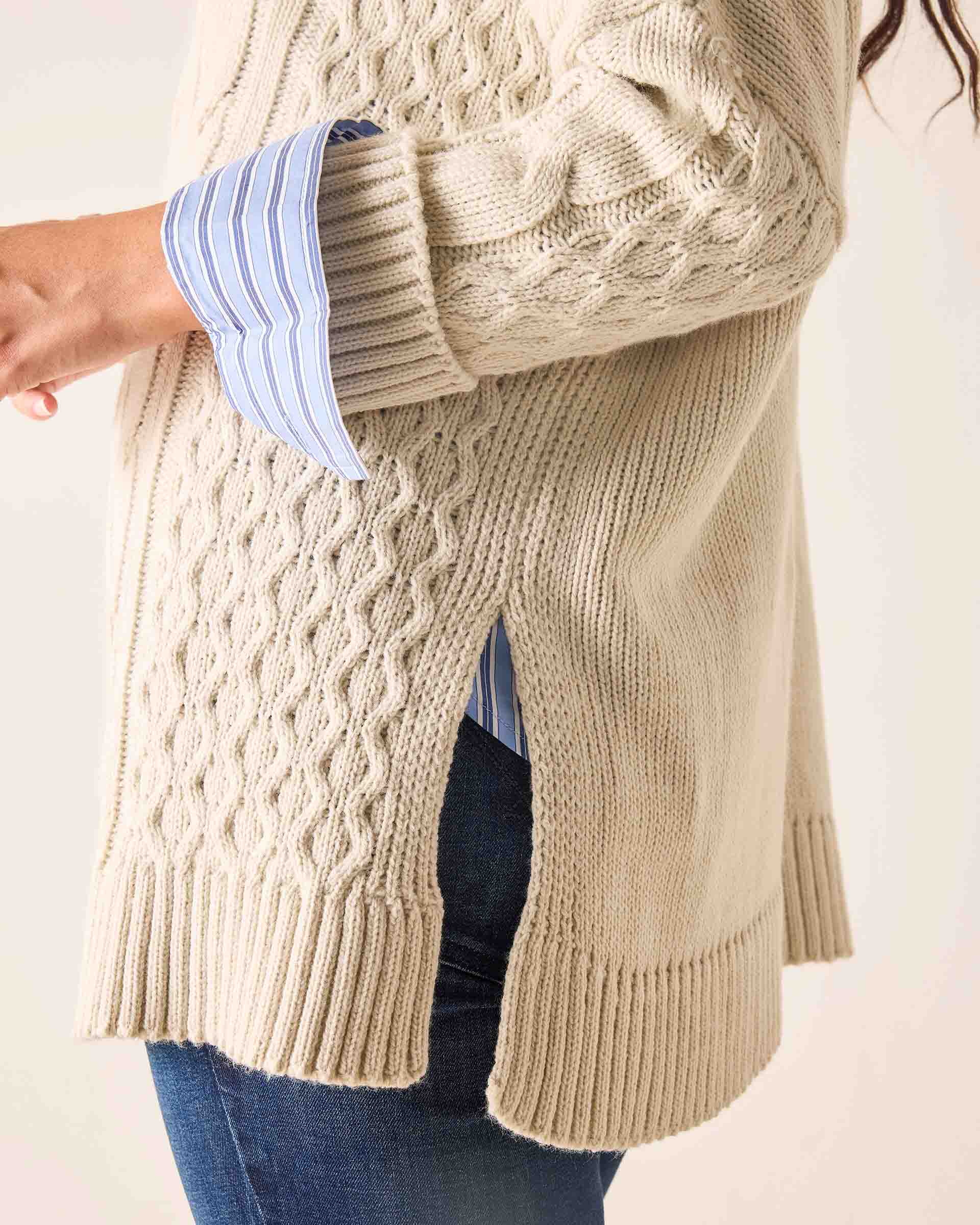 Sea salt knit cable stitch sweater featuring a textured knit pattern and dropped shoulders.