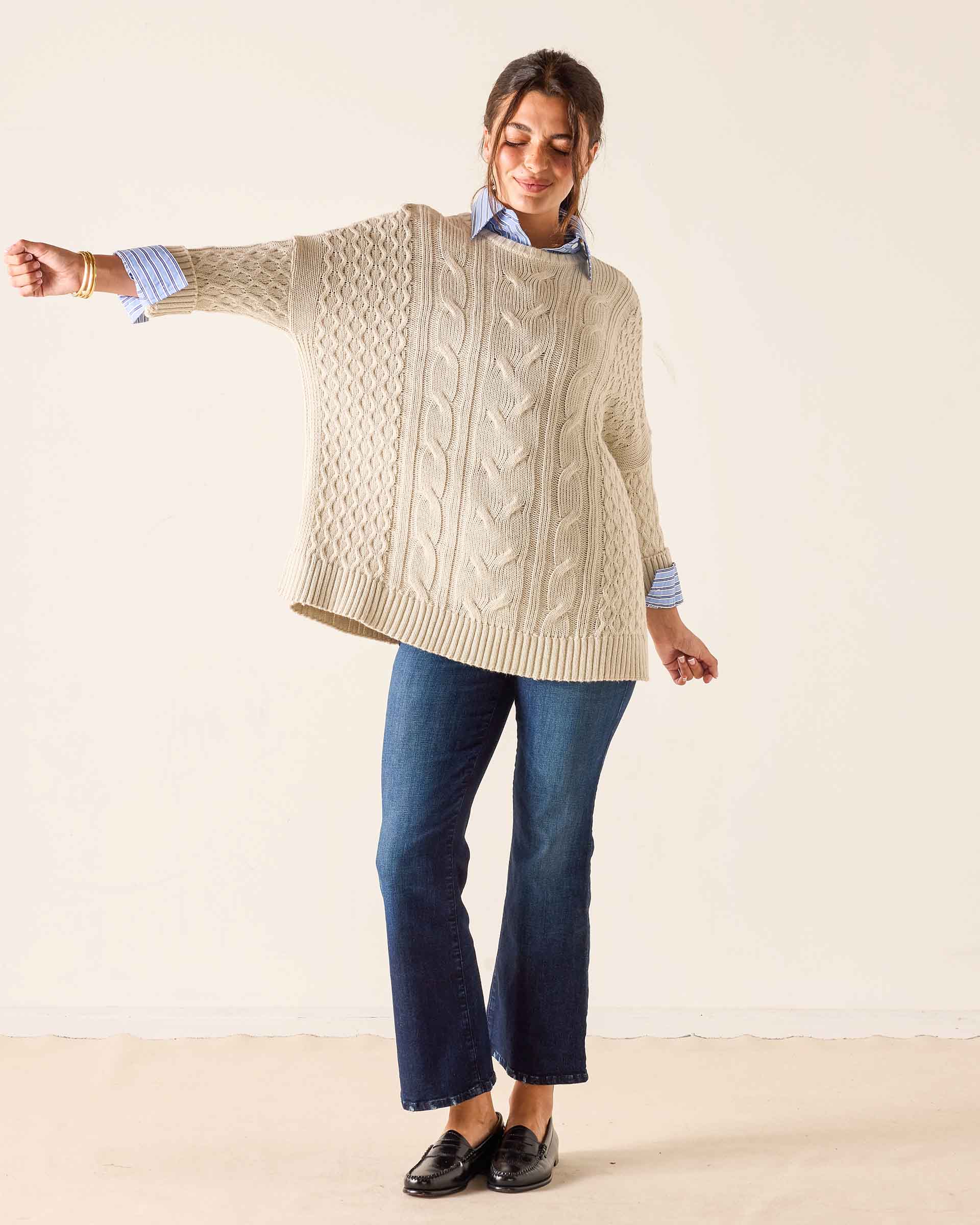 Sea salt cream knit cotton sweater with cable and pointelle stitch patterns.