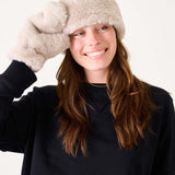 Oatmeal cream faux fur headband with a large knotted detail.