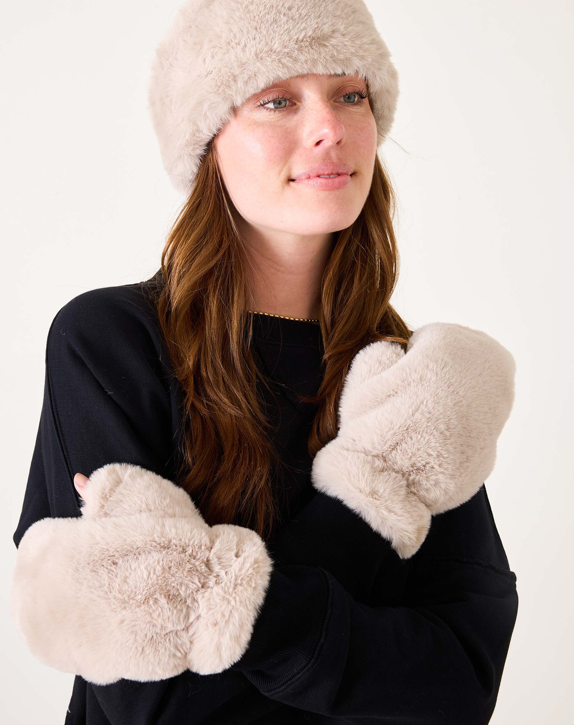 Oatmeal and cream faux fur mittens with a soft cozy feel.