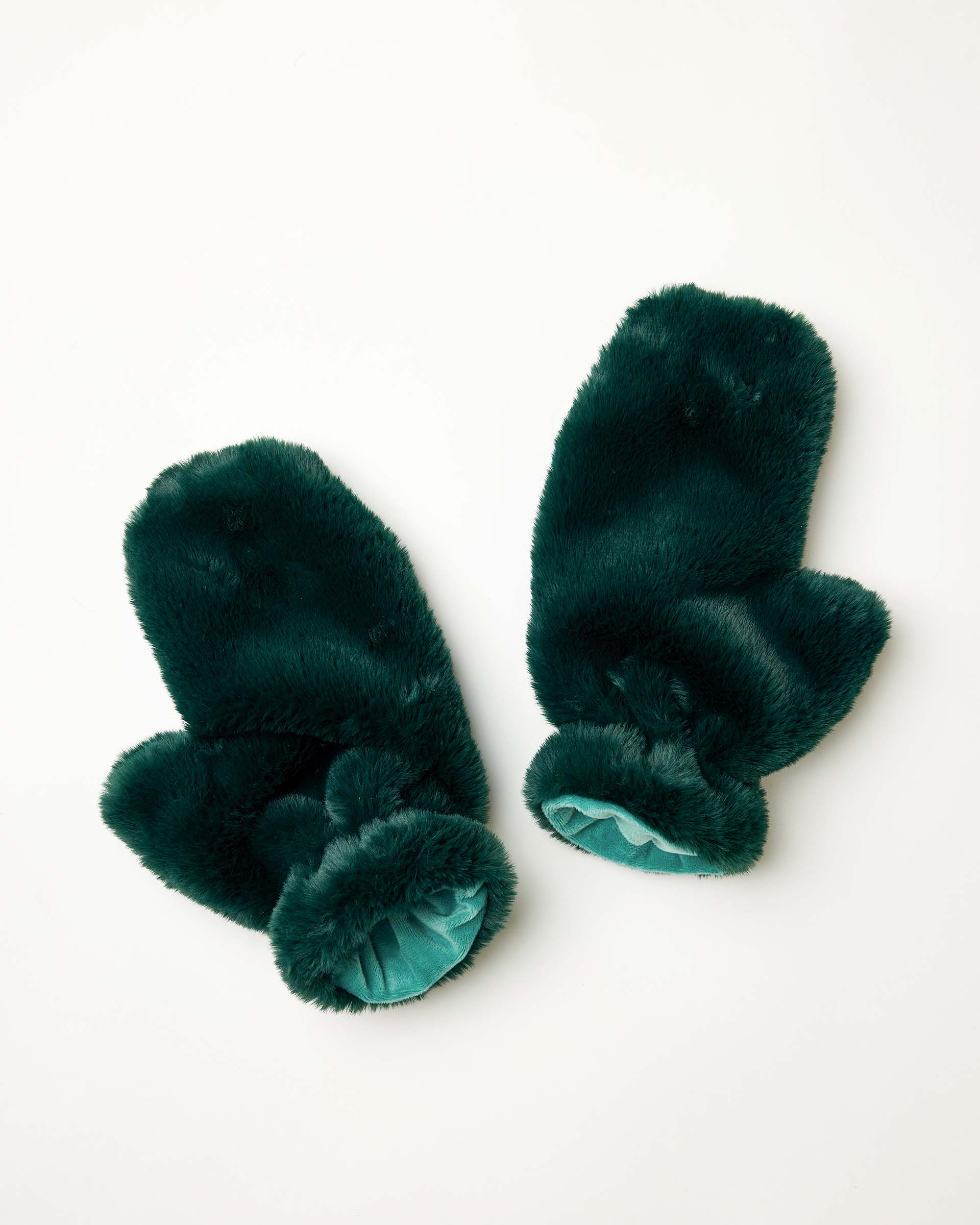 Women's travel-friendly pine green faux fur mittens with a plush fuzzy finish and teal interior lining.