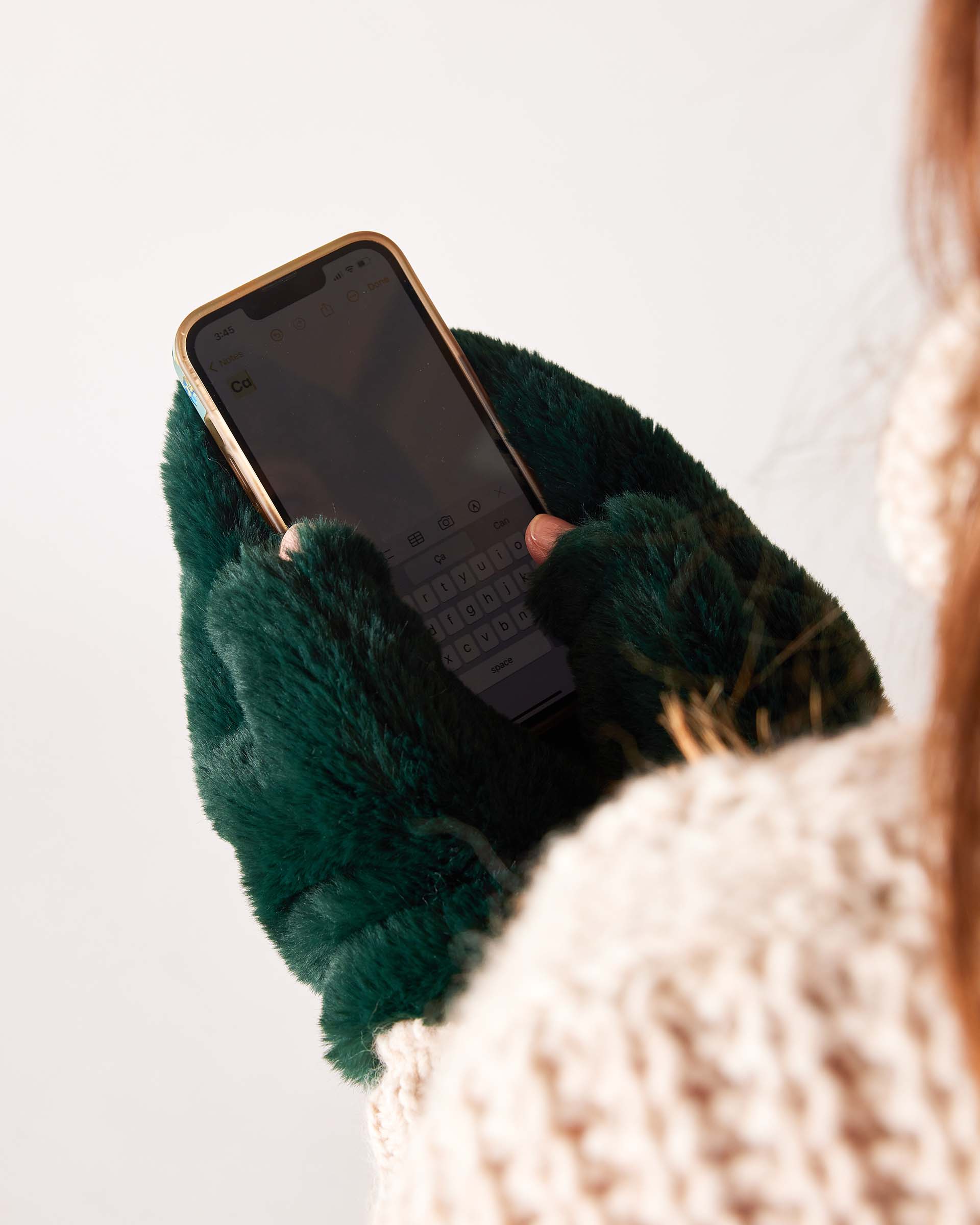 Pine green faux fur mittens with a soft plush finish.