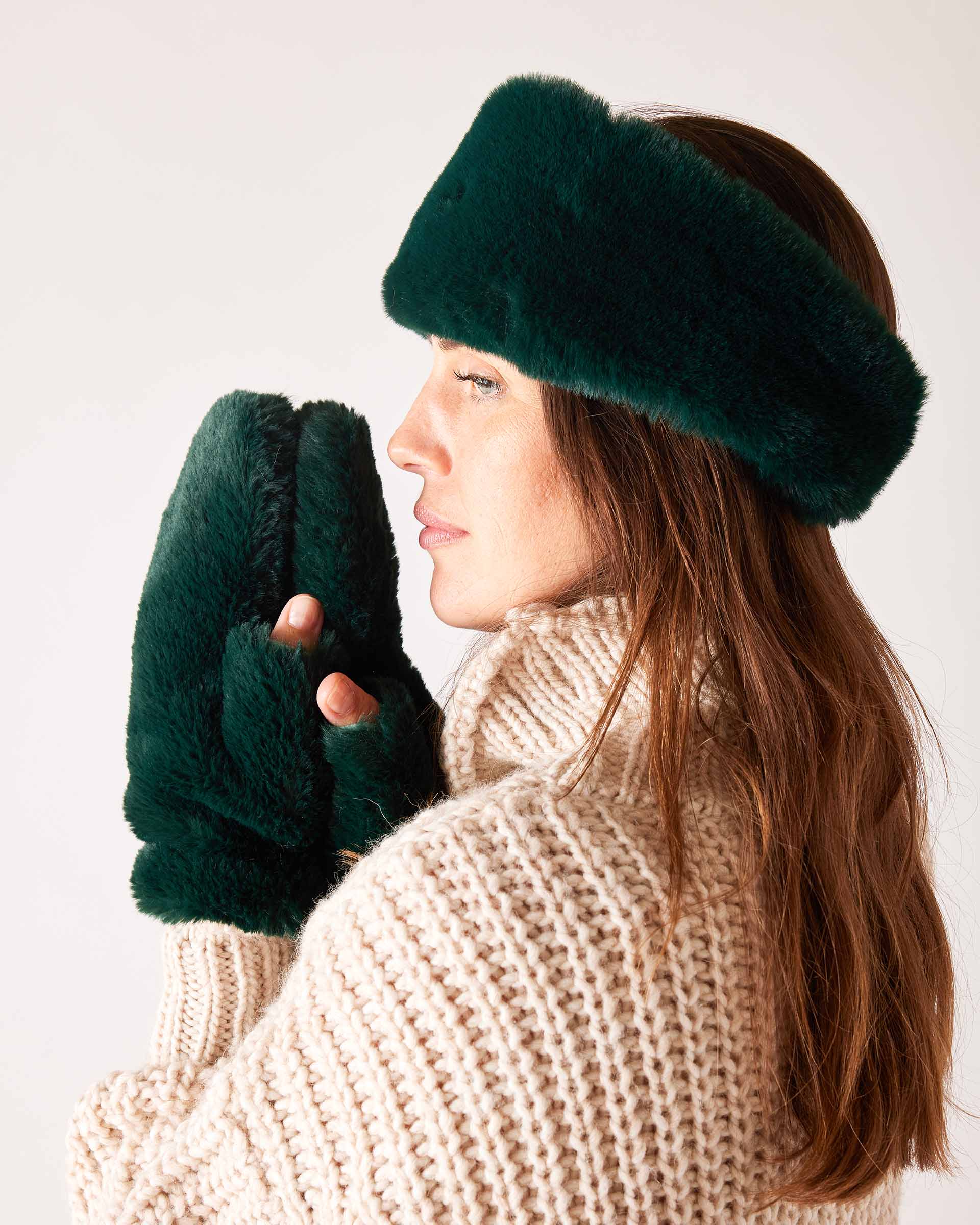 Pine green faux fur headband and matching mittens with a soft, plush finish.
