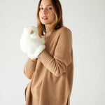 woman wearing mersea cozy cabin faux fur mittens in whisper white