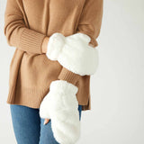 closeup of woman wearing mersea cozy cabin faux fur mittens in whisper white