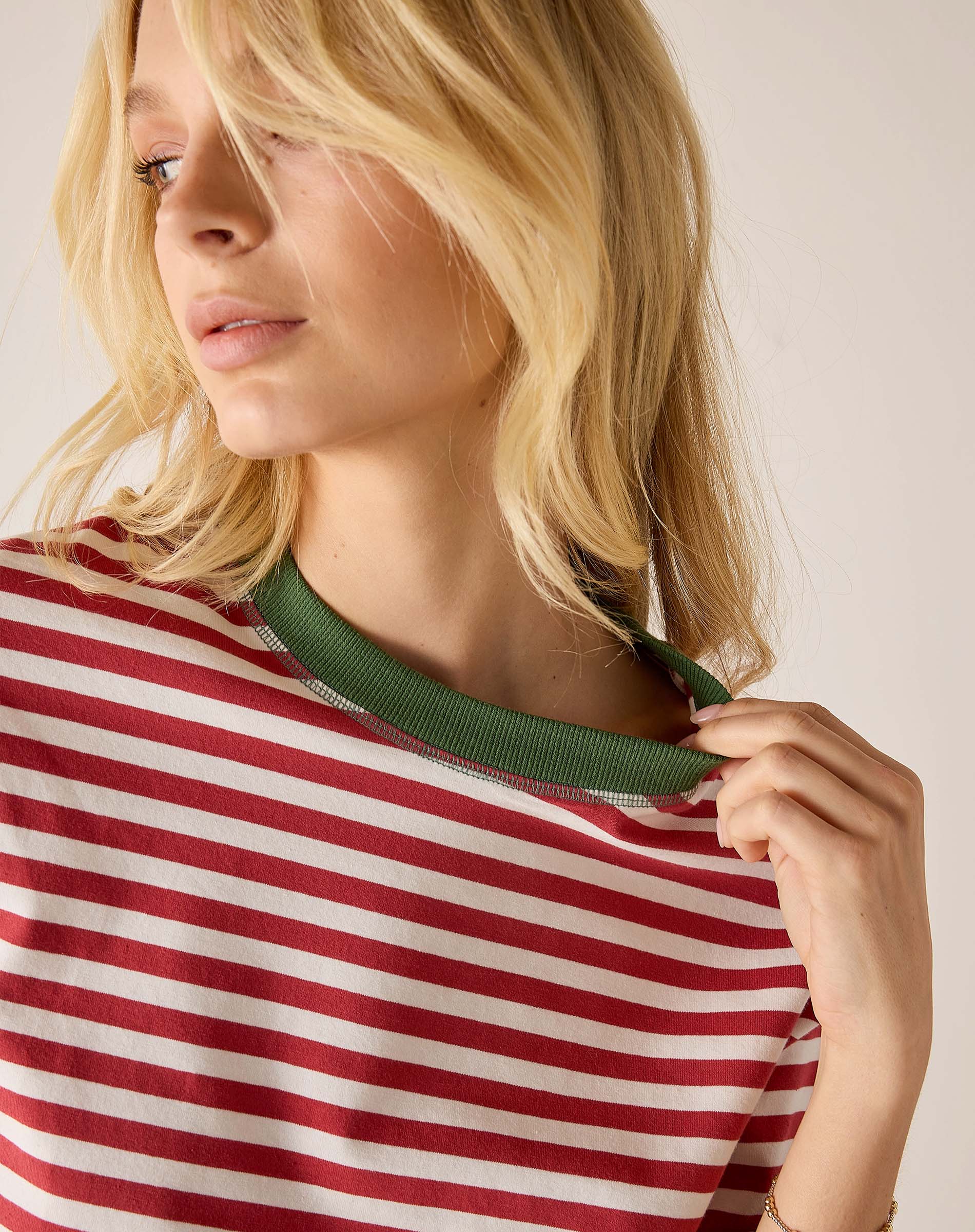 Currant and jade striped ringer tee with a contrasting green collar.