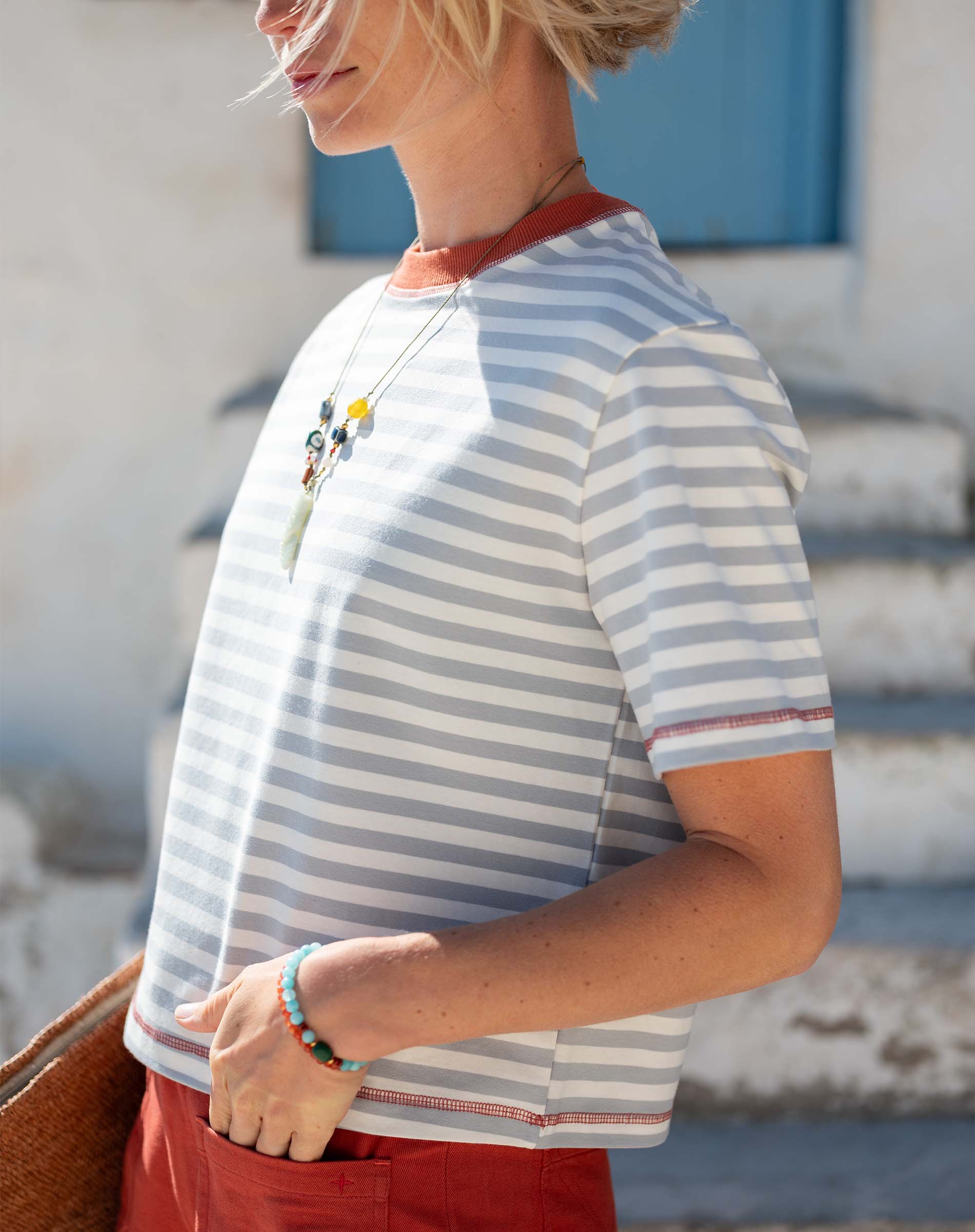 Slate blue and persimmon striped ringer tee with a contrast collar and trim.