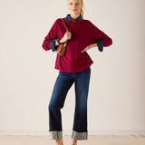 MERSEA ladies' travel-ready sangria knit sweater with a high neckline and layered shirt collar.
