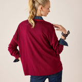 Back view of women's travel-friendly sangria knit sweater with contrasting dark trim and long sleeves.