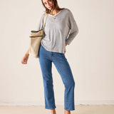 MERSEA ladies' travel-ready silver cloud v-neck knit top with long sleeves and a slouchy fit.