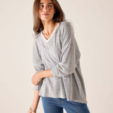 Silver cloud v-neck knit top with long sleeves and a relaxed fit.