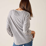 Back view of the silver cloud v-neck knit top with long sleeves.