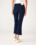 lower body rear view of Woman wearing Mersea Moody blue Nomad cropped mini boot-cut jeans standing on white background