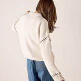 Cream whipstitch knit sweater with statement stitching detail