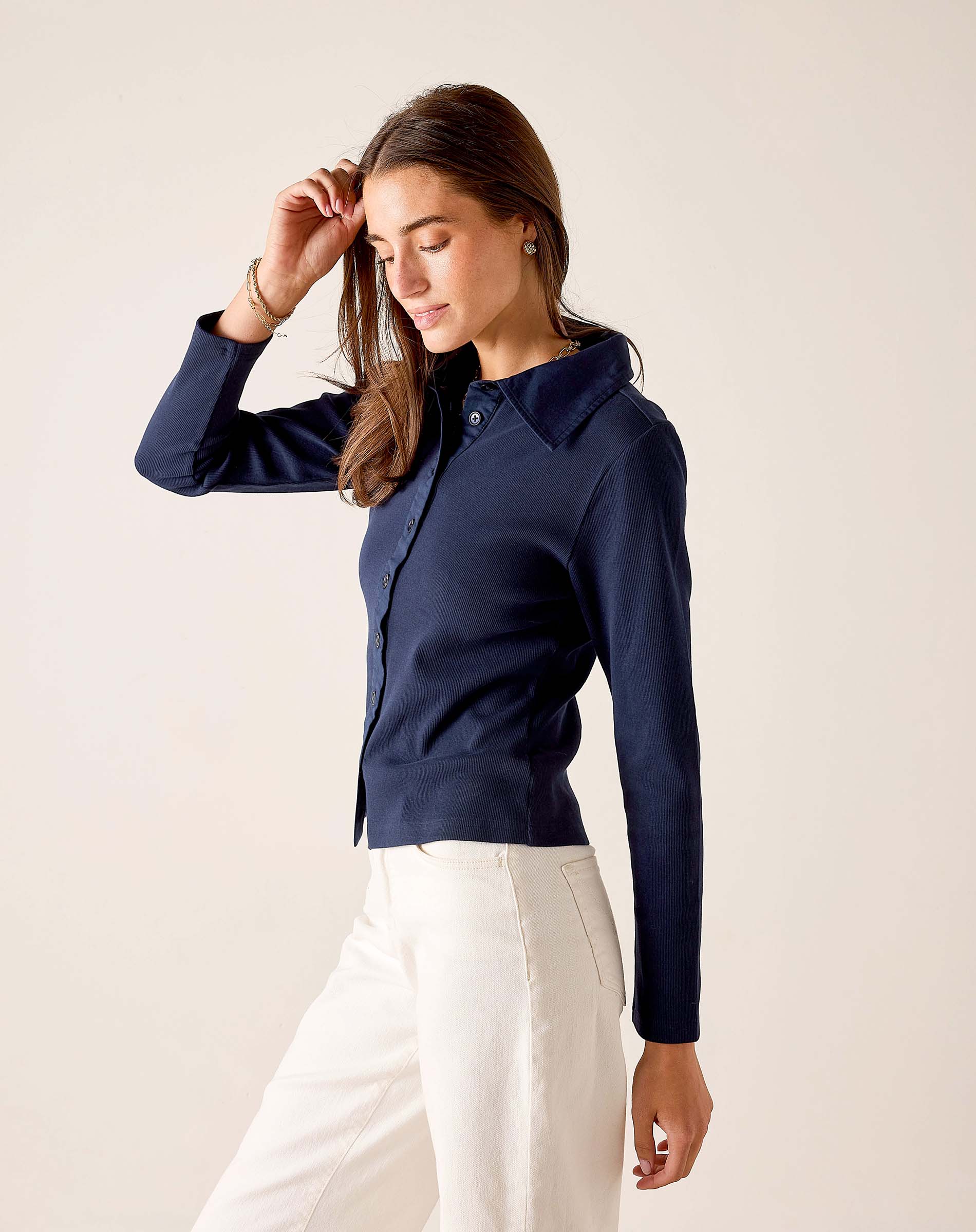 Navy ribbed oxford button-down top with a pointed collar and full sleeves.