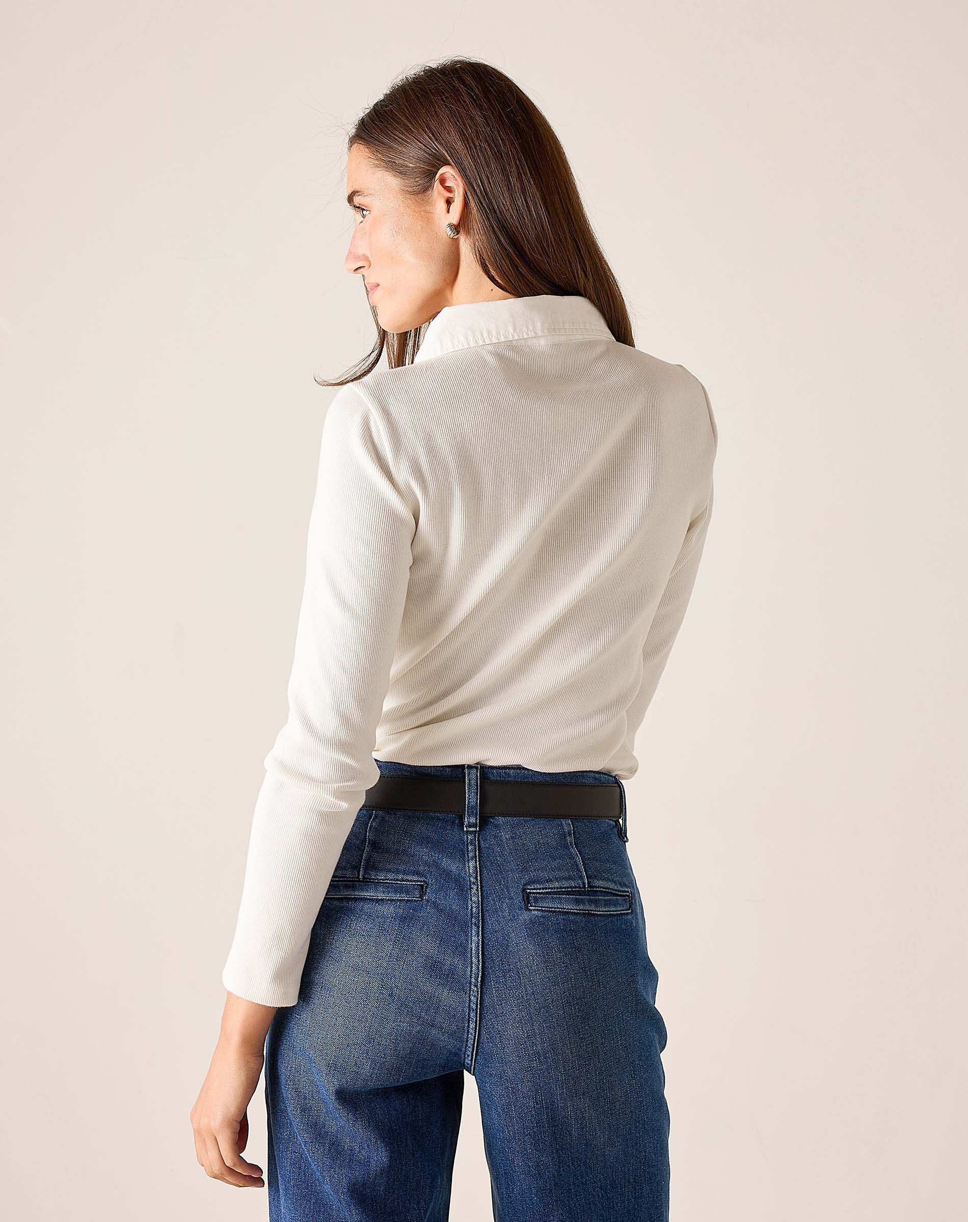 Side view of the white ribbed oxford button-down shirt.