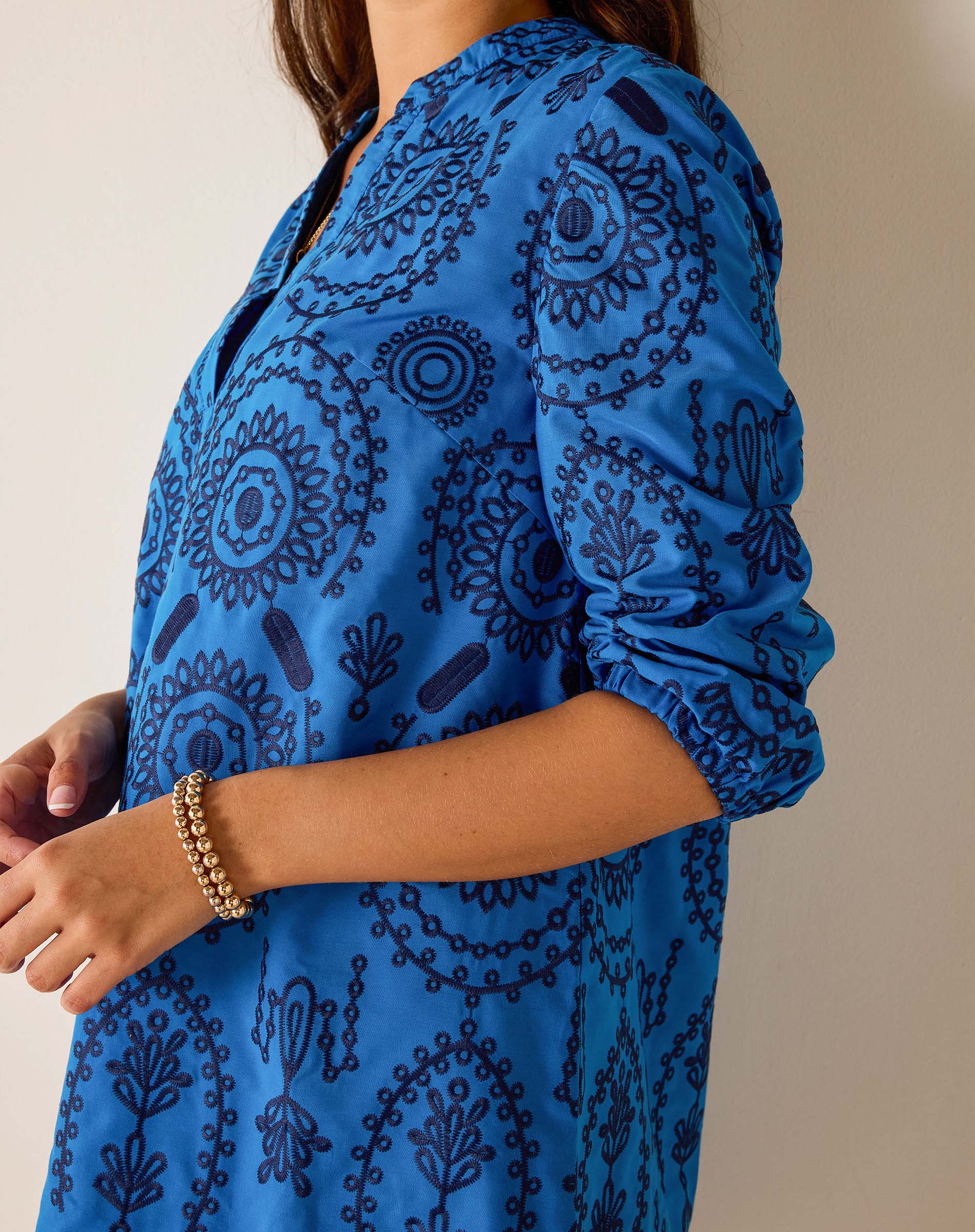Blue patterned dress with a neutral background