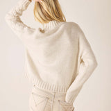 Cream cable knit oversized sweater with wide ribbed hem and sleeves.
