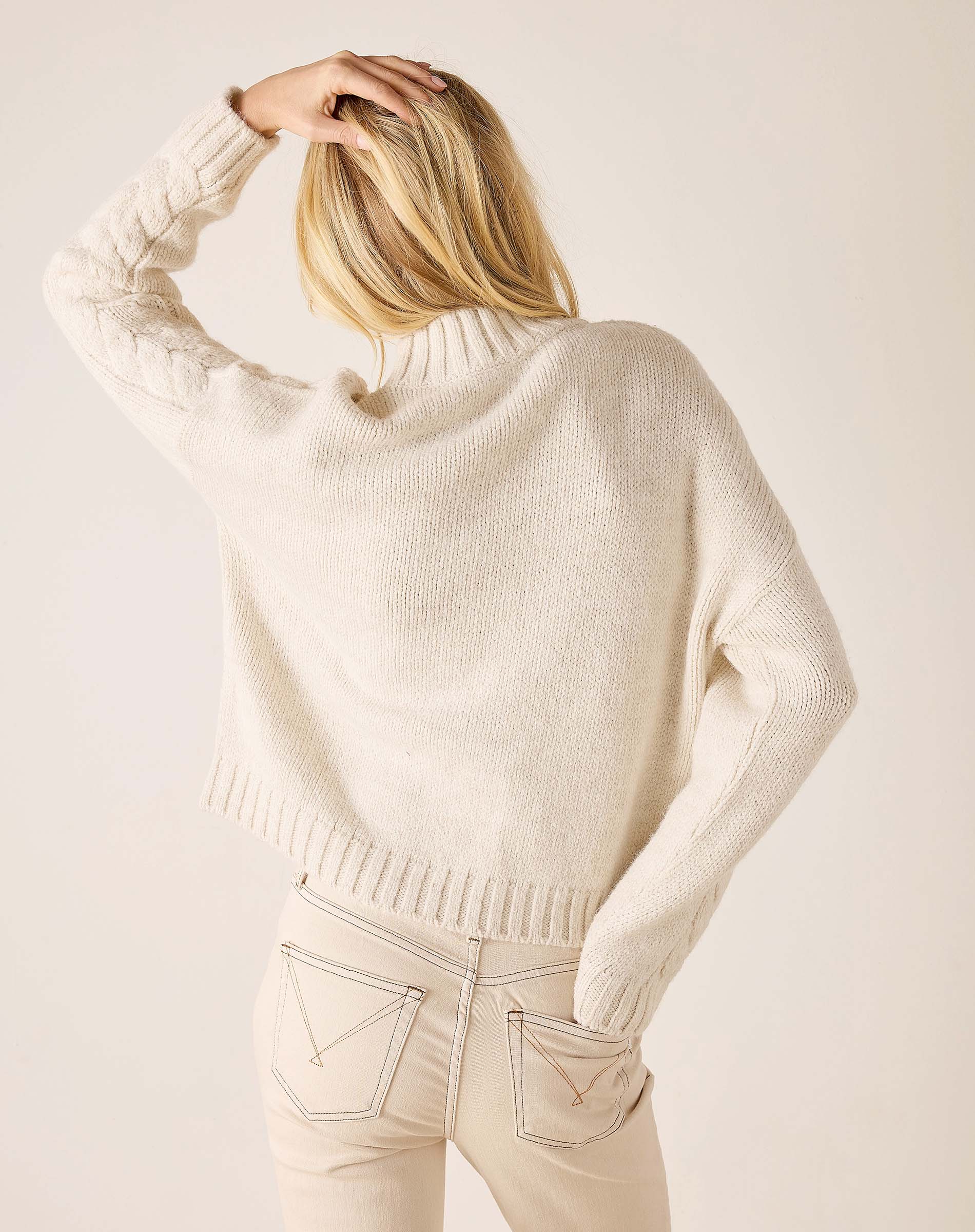 Cream cable knit oversized sweater with wide ribbed hem and sleeves.