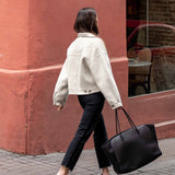 Ladies' travel-ready dove gray knit cardigan with a relaxed fit and large buttoned cuffs.