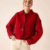 Garnet red wool-blend knit shirt jacket with a collar, front buttons, and large patch pockets.