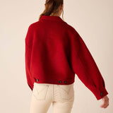 Back view of women's travel-friendly garnet red knit wool-blend jacket with buttoned cuffs and relaxed fit.