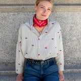 Off-white cherry print button-down shirt with long sleeves and a red patterned bandana.