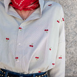 White pinstripe button-down shirt with a cherry print and long sleeves.