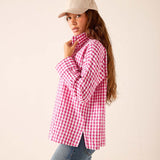 Dark pink gingham button-down shirt with a relaxed fit and long sleeves.