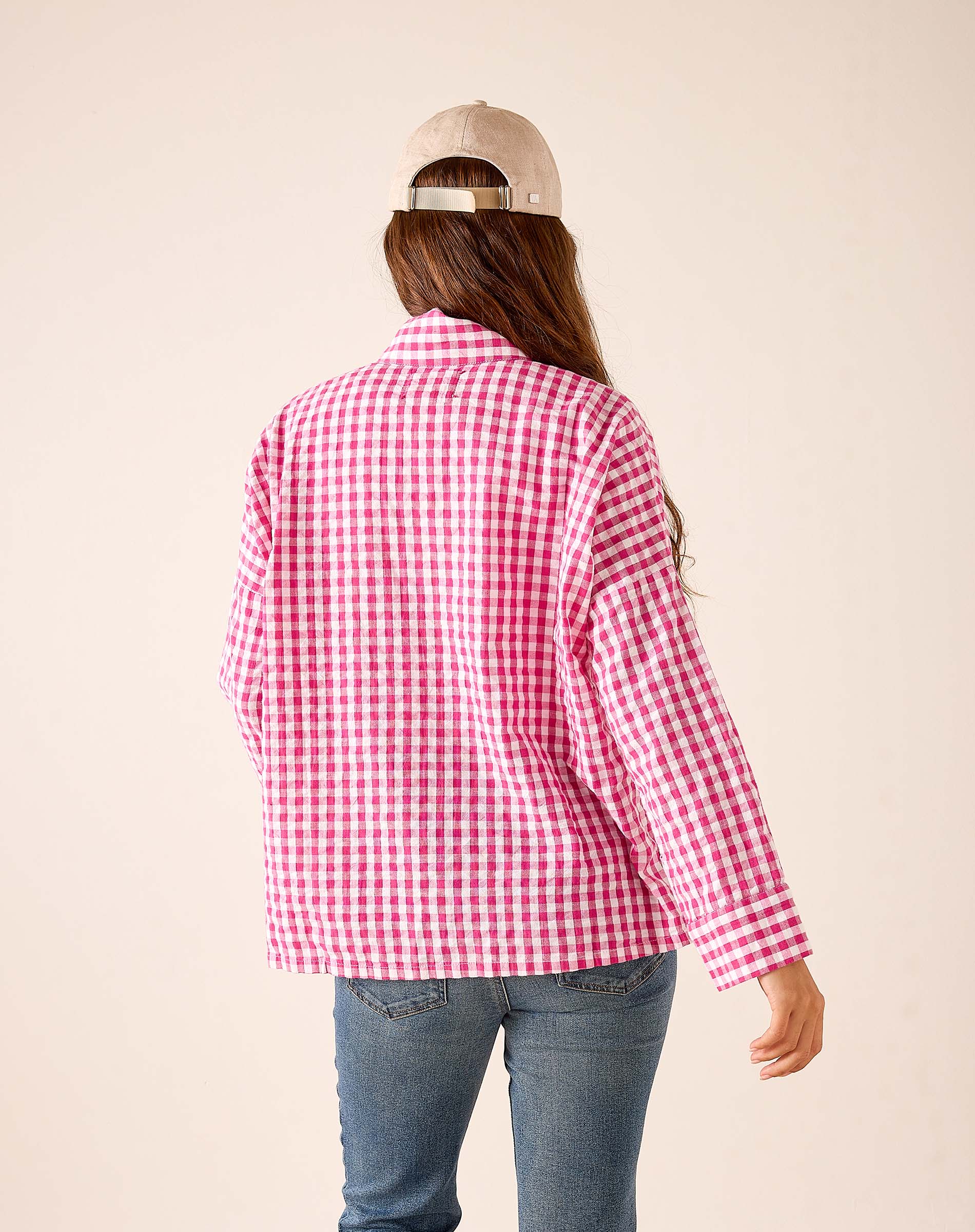 Back view of women's travel-friendly dark pink gingham cotton button-down shirt