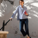 MERSEA ladies' travel-ready blue double-stripe Elizabethan collar top with buttoned cuffs and a stand collar.