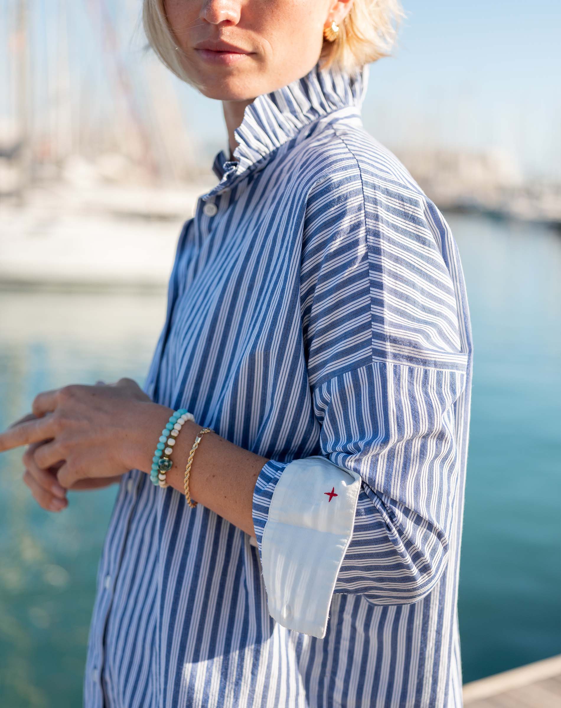Blue double stripe top with a ruffled Elizabethan collar and cuffs.