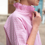 Rose pinstripe top with a ruffled Elizabethan collar and long sleeves