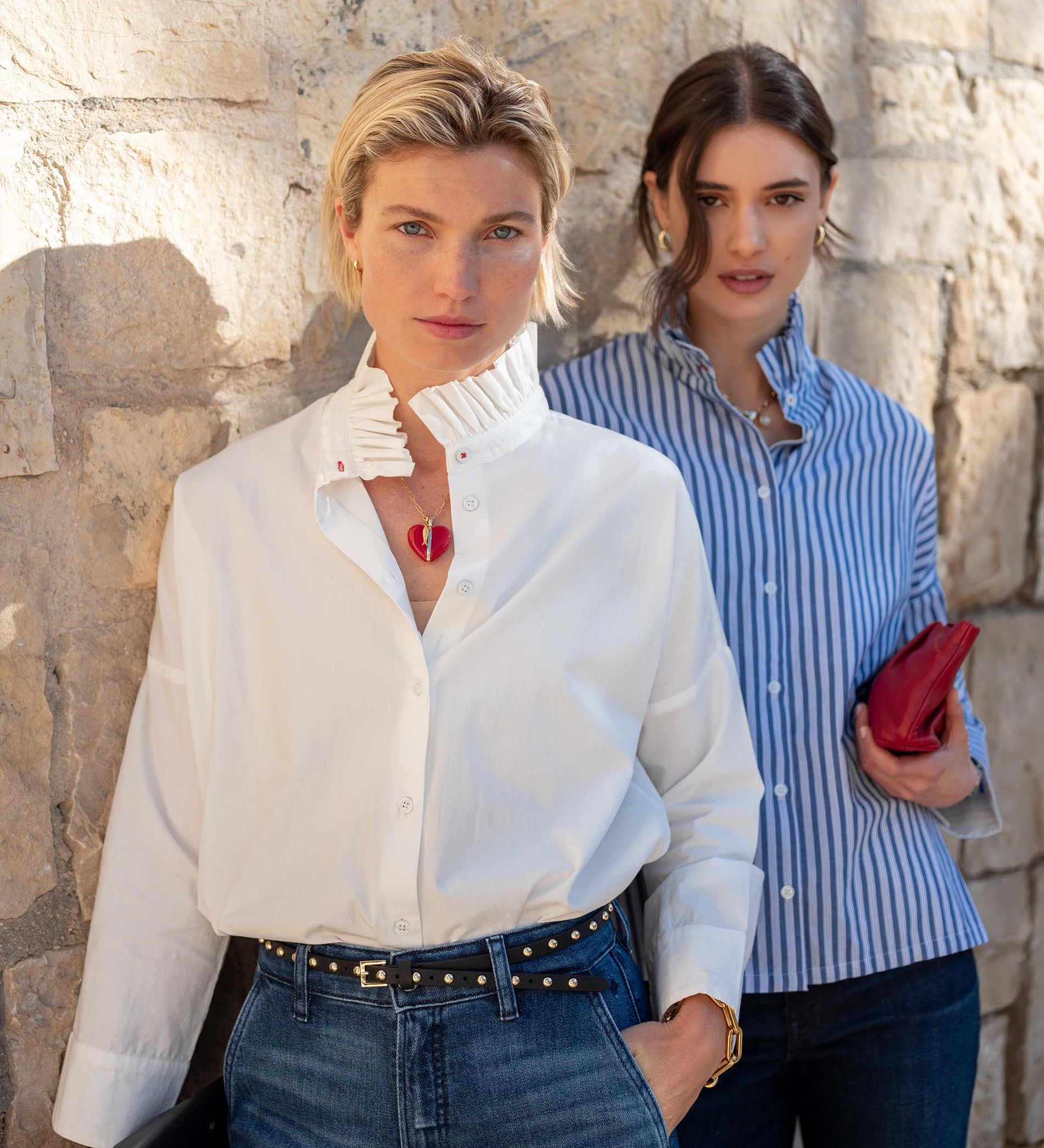 White button-down blouse featuring a unique Elizabethan ruffled collar and long sleeves.