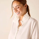 White linen-look top with a ruffled Elizabethan collar