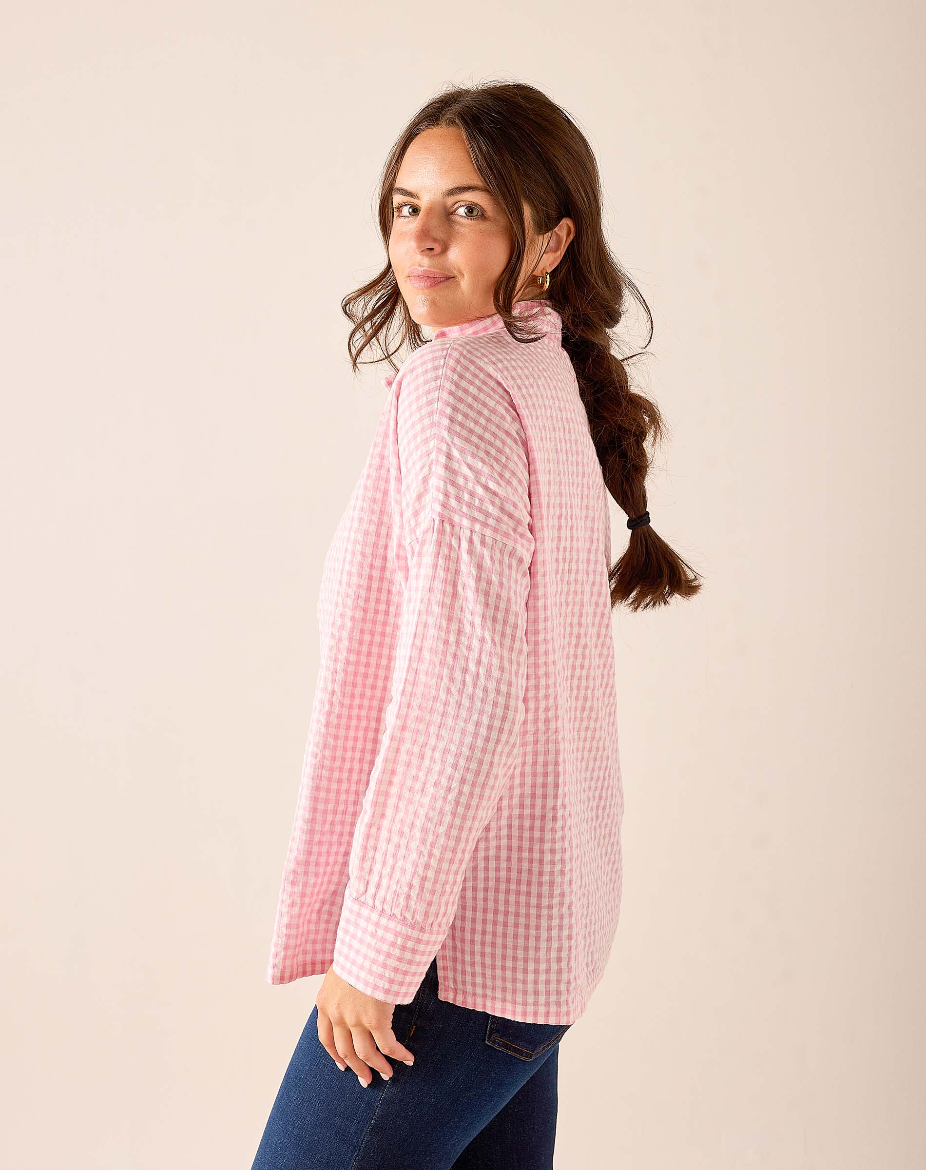 Light pink gingham button-down shirt with a relaxed fit and lightweight texture.