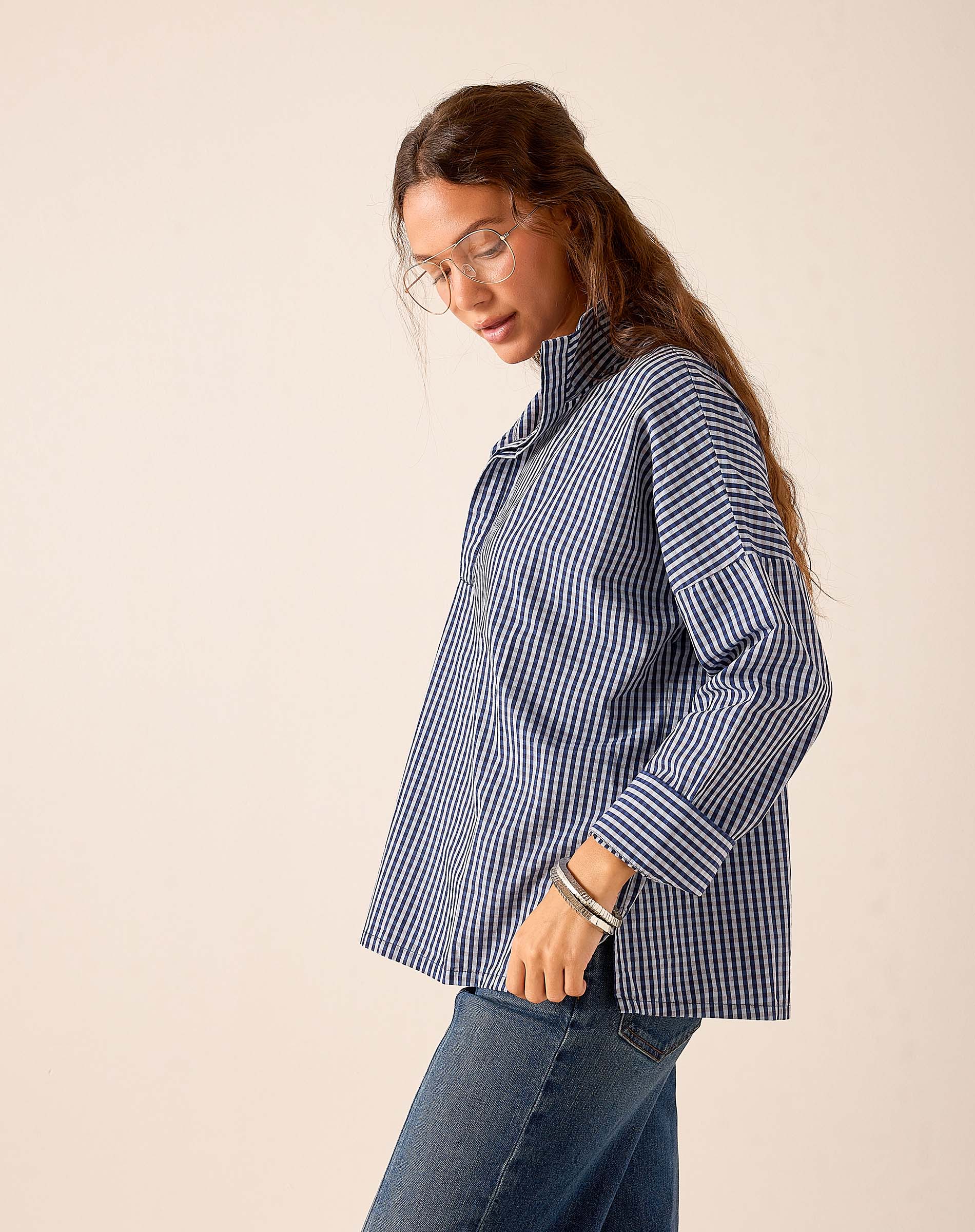 Navy gingham cotton button-up shirt with long sleeves and a collar.