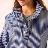 Navy gingham button-up shirt with a stand collar and buttons down the front.