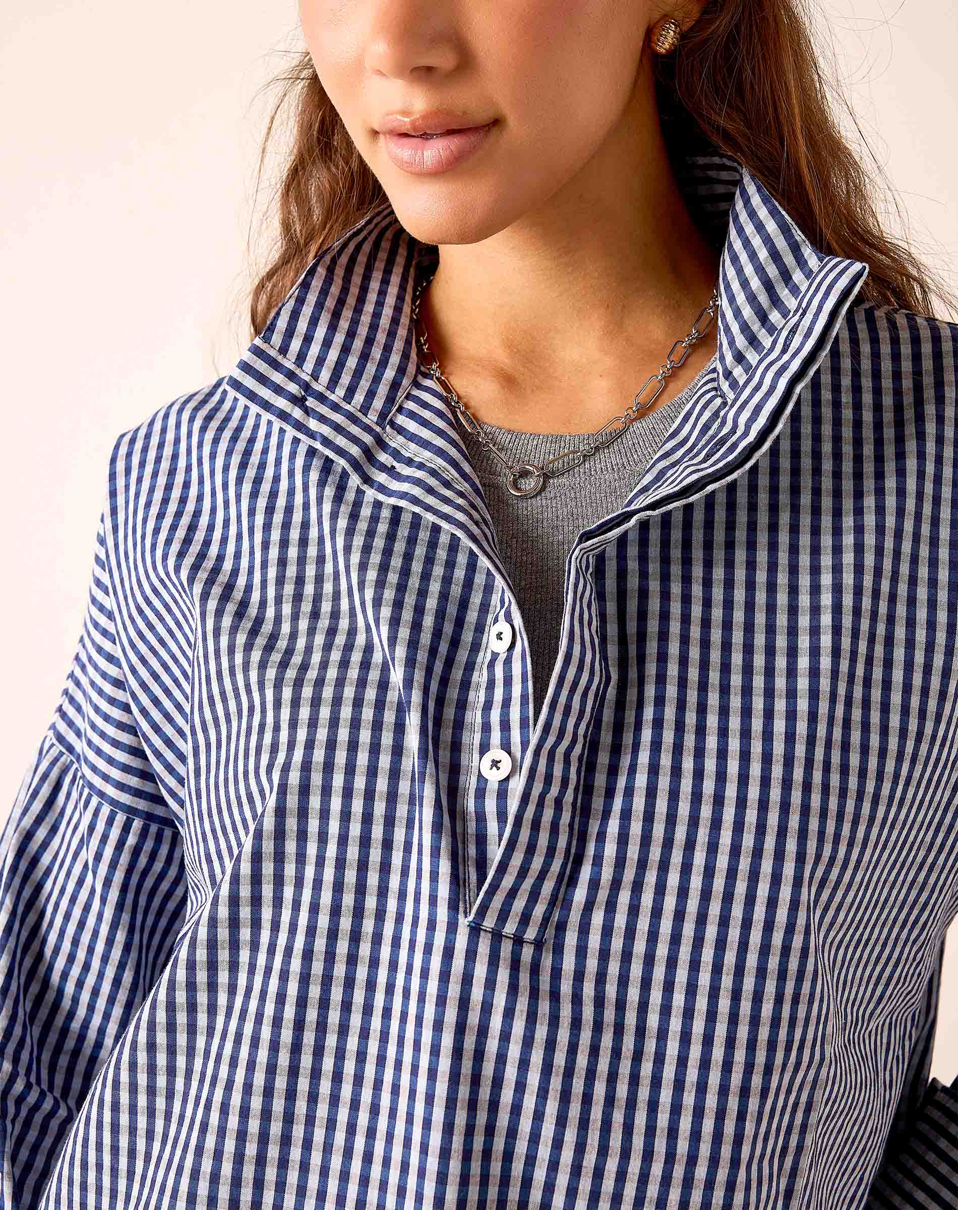 Navy gingham button-down shirt with a collar and front buttons.