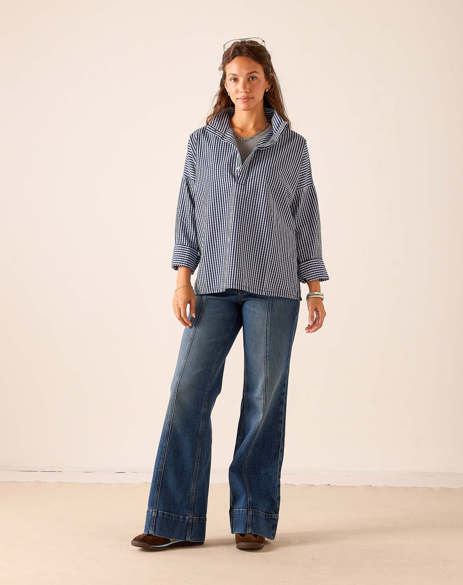 Navy gingham oversized tunic top with a buttoned front and 3/4 sleeves.