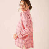 Pink plaid button-down shirt with long sleeves and a relaxed fit.