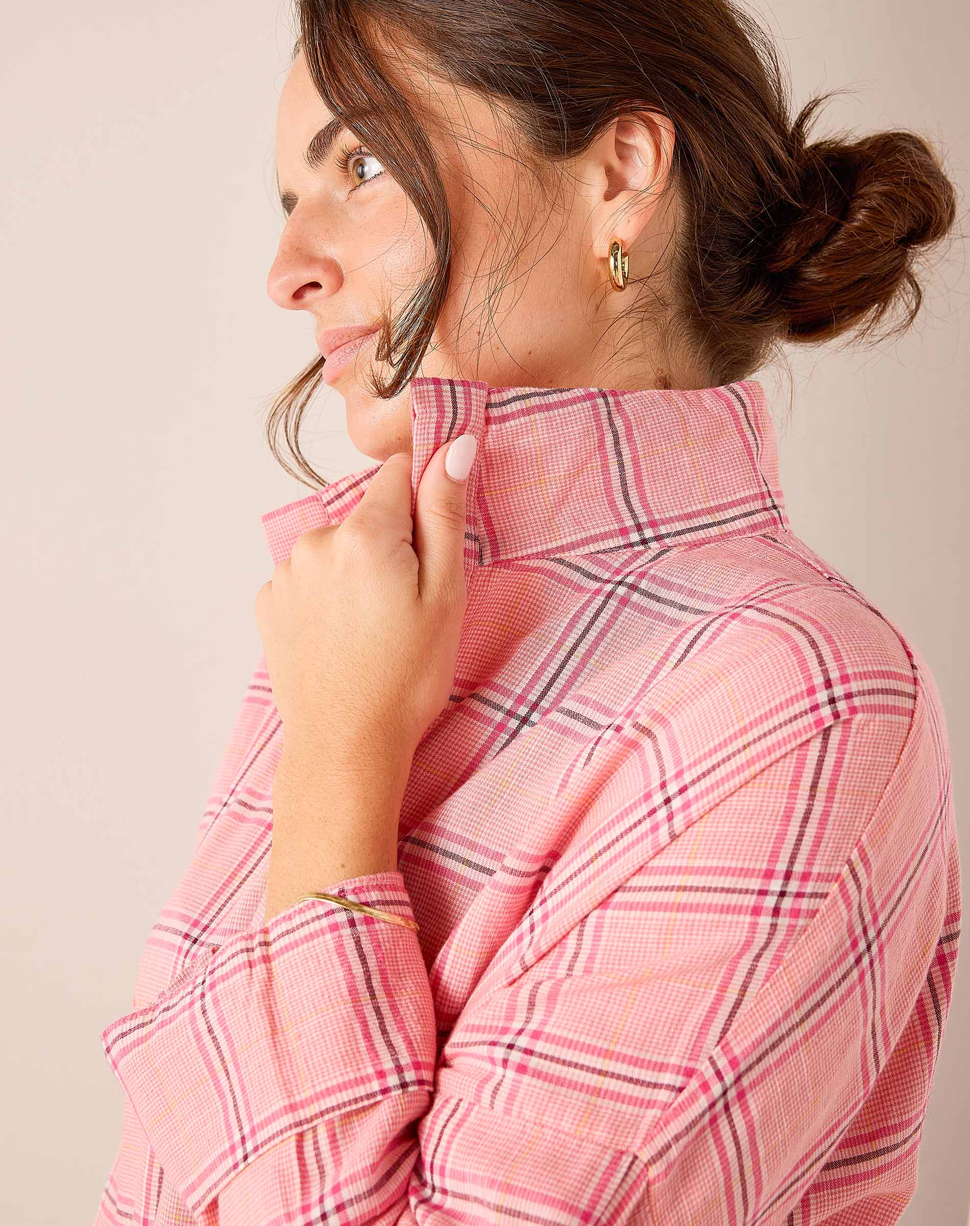 Pink plaid button-up shirt with a stand collar.