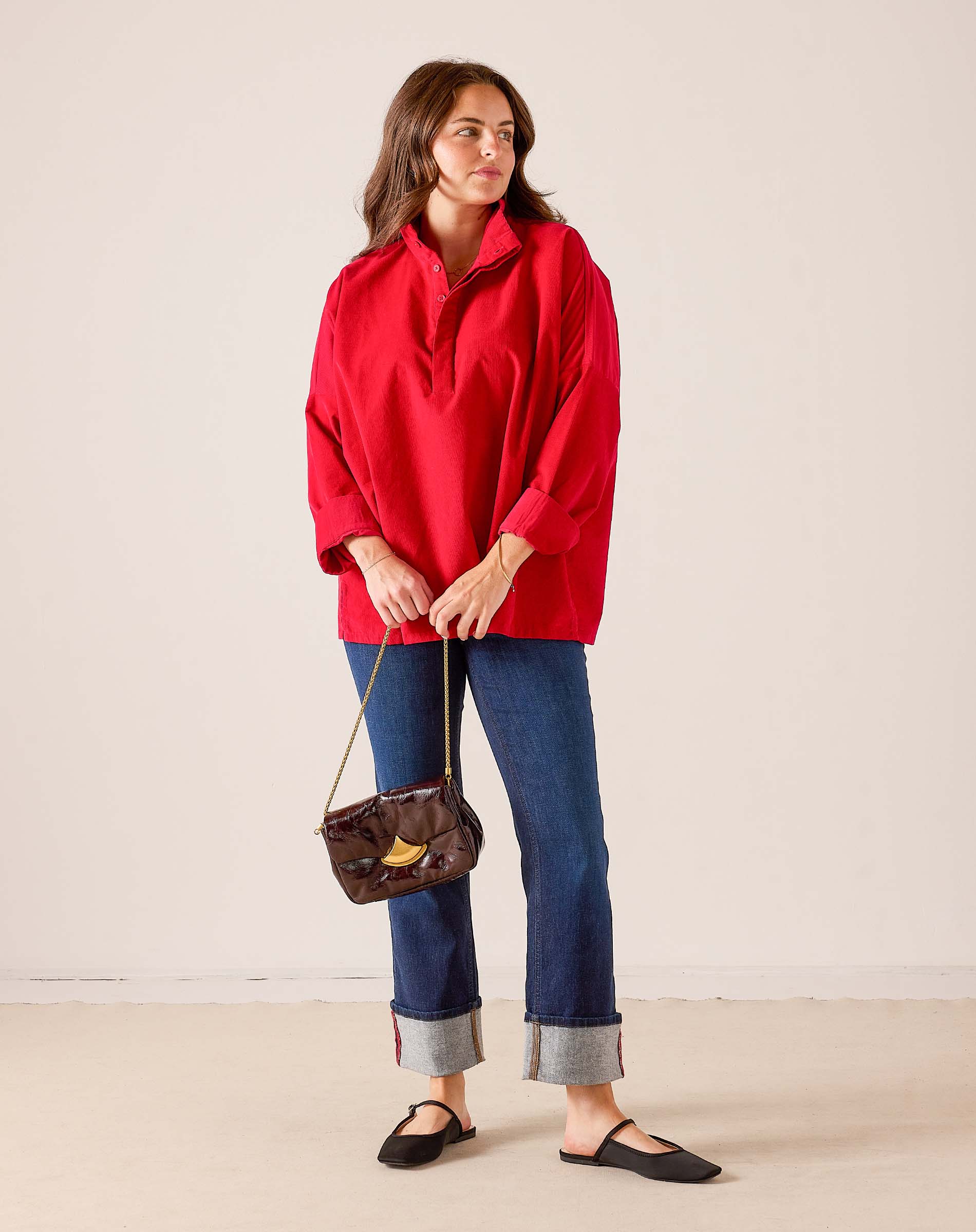 Women's travel-friendly cardinal red oversized tunic top with a half-zip neckline and three-quarter sleeves.