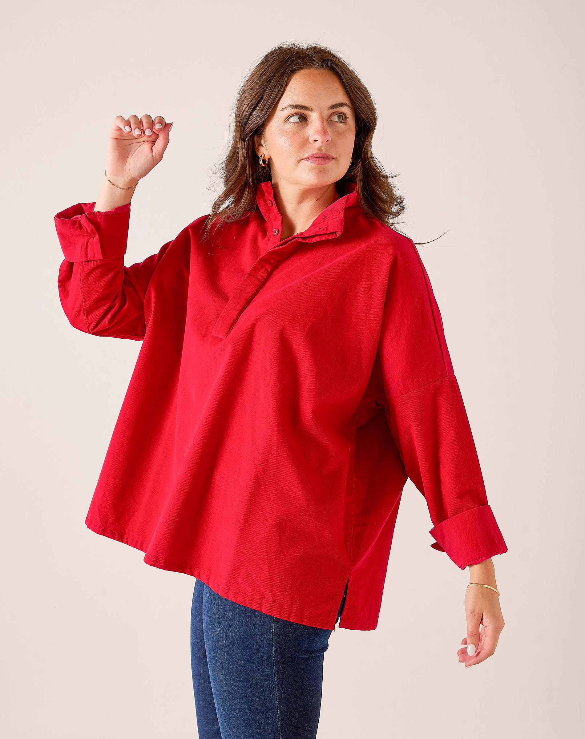 Cardinal red oversized linen blend top with a buttoned collar and wide sleeves.