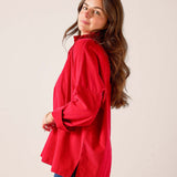 Cardinal red oversized linen-blend tunic top with buttoned cuffs and relaxed fit.