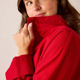 Cardinal red high-neck knit top with ribbed detail