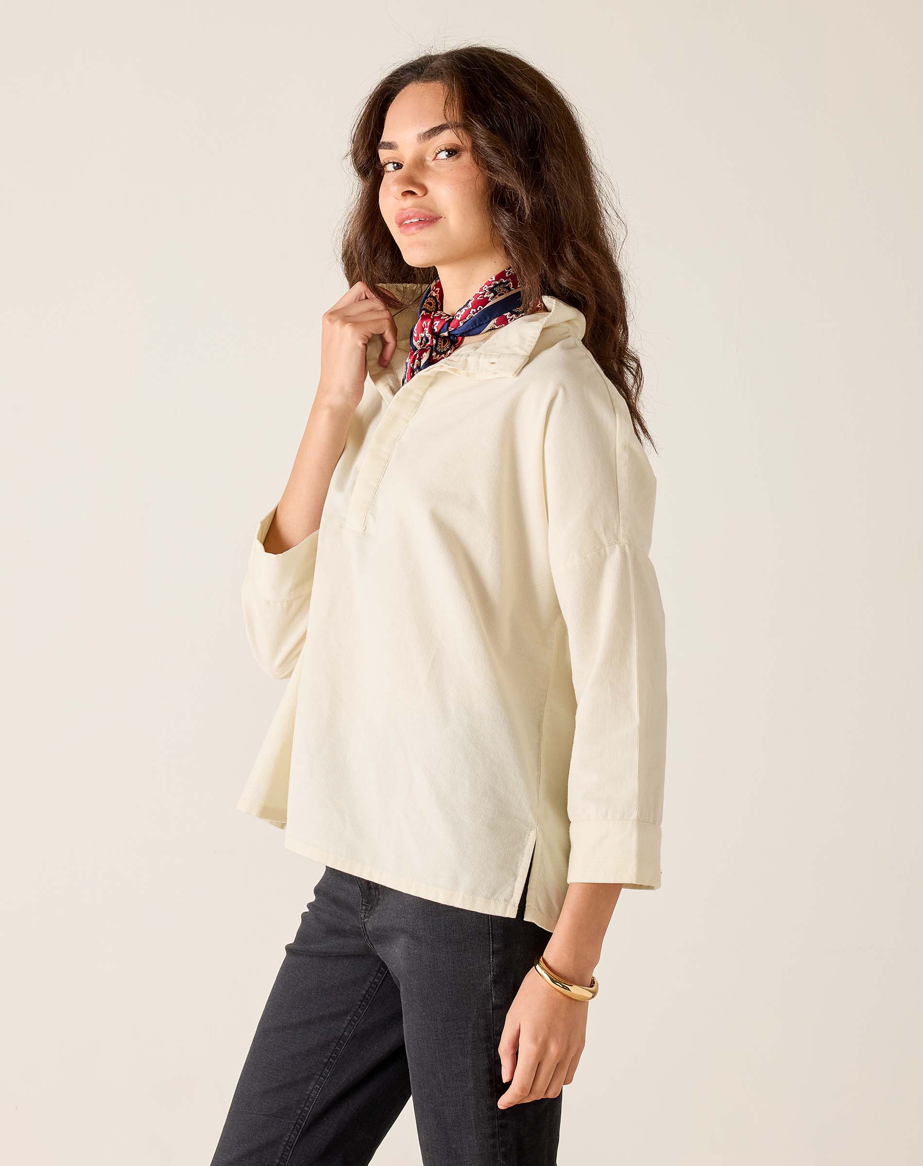 Opal white relaxed-fit linen-blend tunic top with a buttoned placket and side slits.