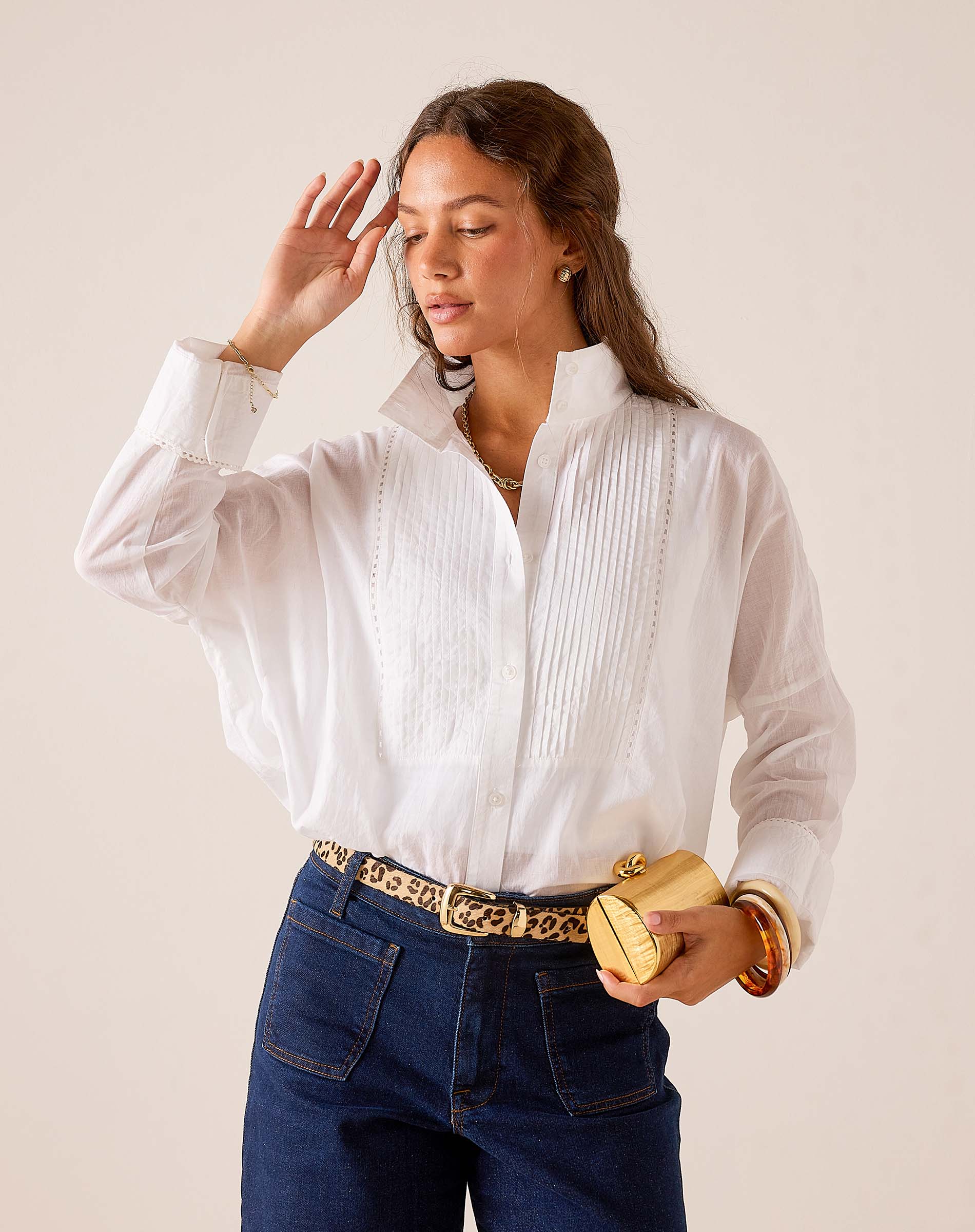 Women's travel-friendly white relaxed-fit cotton Emerson Tux top featuring pintuck detailing and pleated front panels.